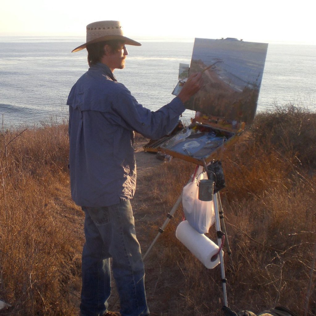 Jeff Sewell at his easel during golden hour