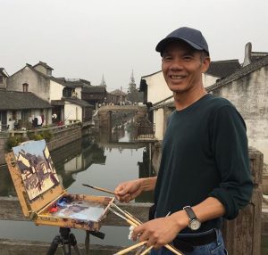 Michael Situ at his easel Invitational artist